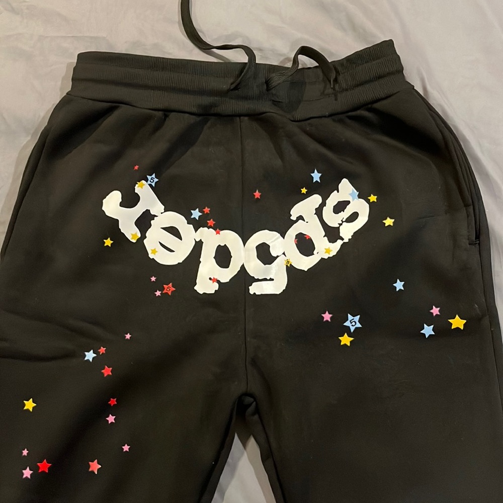 mens Spyter sweatpants. Size medium. Color black and white with colored stars.